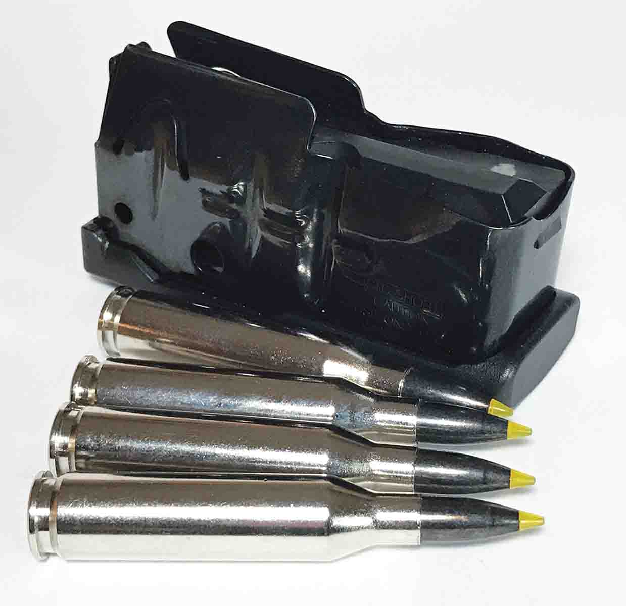 The detachable magazine holds four .243 Winchester cartridges in a straight stack.